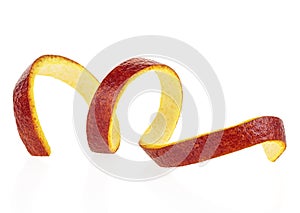 Sicilian orange peel on white background. Spiral of orange fruit