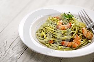 Sicilian pasta with pistachio pesto and shrimp photo