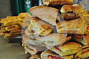 Sicilian street Italian food: pane cunzato. Tomato, pecorino sandwich