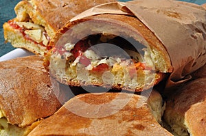 Sicilian street Italian food: pane cunzato. Tomato, pecorino sandwich