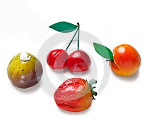 Marzipan fruits on a white background photo