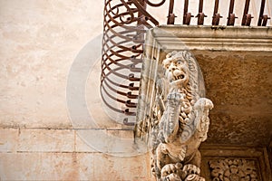 Sicily, Noto town the Baroque Wonder - UNESCO Heritage Site. Detail of Palazzo Nicolaci balcony, the maximum expression of the