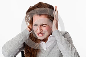 Sick 20s woman at tinnitus or listening to loud music