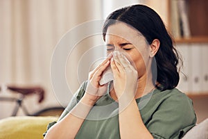 Sick, allergy and blowing nose with woman on sofa for virus, hayfever or illness. Healthcare, disease and allergies with