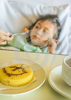 Sick Asian Child Hospital Patient Bored with Hospital Menus photo