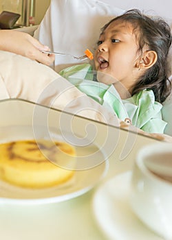 Sick Asian Child Hospital Patient Having Meal on Bed