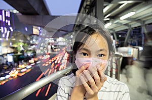 Sick asian people wearing protective mask,child girl has cough,choking on air pollution,problems of toxic dust,smog,fine dust,air