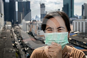 Sick asian woman had a cough,sore throat or symptoms of a cold flu,uncomfortable,people wearing medical protective mask in the