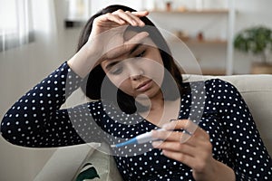 Sick Asian woman measure high temperature feeling unwell
