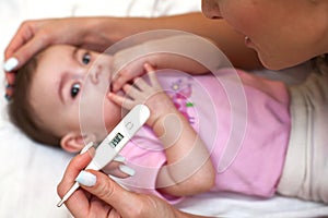 Sick baby being checked for illness.