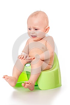 Sick baby constipation, colic, bloating, indigestion heartburn, digestion, pain, diarrhea. sitting on the potty with toilet paper