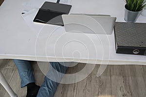 Sick business man laying down unconsciously on floor at office b