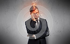 Sick businessman with burning head concept