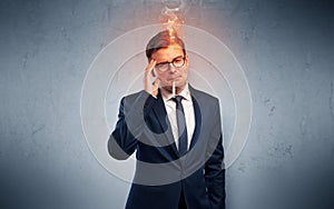 Sick businessman with burning head concept