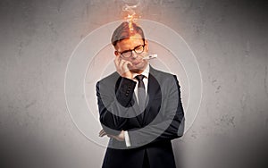 Sick businessman with burning head concept