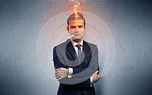 Sick businessman with burning head concept