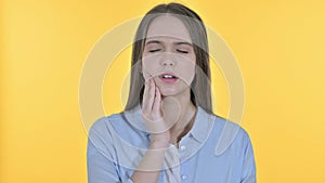 Sick Casual Young Woman having Toothache, Yellow Background