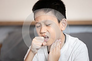 Sick child boy suffering from coughing,sore throat,chronic cough with mucus,Acute bronchitis or chest cold,Pneumonia,Respiratory photo