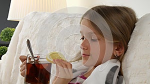 Sick Child Portrait Drinking Lemon Tea, Sad Ill Little Girl Face in Bed, Sofa 4K