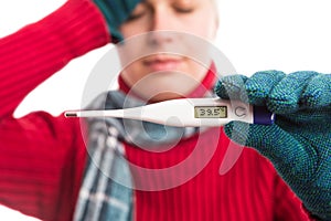 Sick cold woman showing thermometre with high temperature