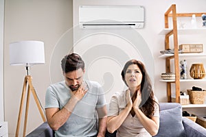 Sick Couple Having Cold From Air Conditioner