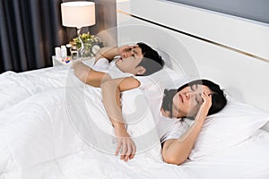 Sick couple headache and suffering from virus disease and fever on bed