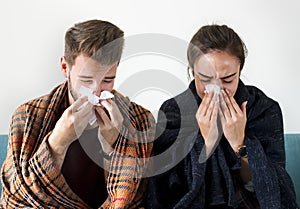 Sick couple with runny nose photo
