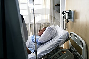 A sick elderly staying at a hospital photo