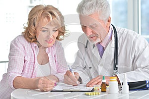 Sick elderly woman in a doctor`s office