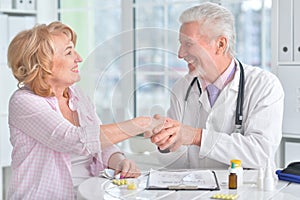 Sick elderly woman in a doctor`s office