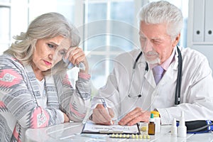 Sick elderly woman in a doctor`s office