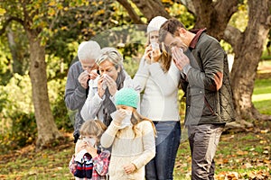 Sick family blowing their noses