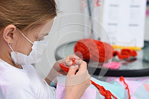 Sick girl crochets a lying in bed