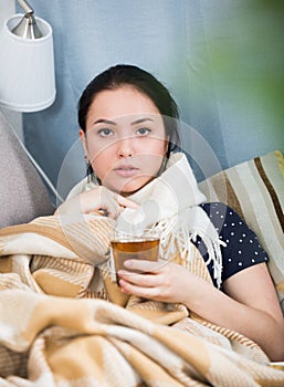 Sick girl under blanket