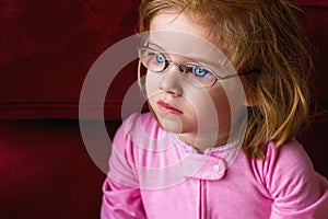 Sick Girl With Very Thick Glasses and Magnified Blue Eyes