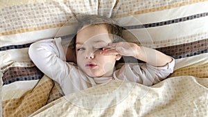 Sick or ill child in bed