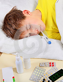 Sick Kid with Thermometer