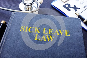 Sick Leave Law book and the stethoscope.