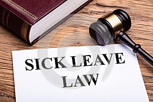 Sick Leave Law Documents With Book And Gavel