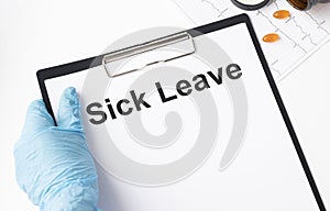 Sick Leave write on a paperwork isolated