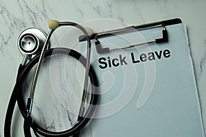 Sick Leave write on a paperwork isolated on office desk