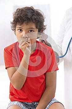 Sick Little Boy Coughs in the Doctors Office
