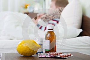 Sick little boy lying in bed