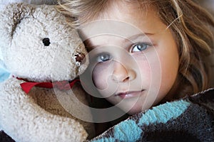 Sick little girl with teddybear
