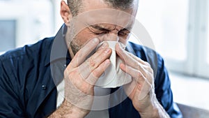 Sick Man Blowing Nose In Paper Tissue At Home, Panorama