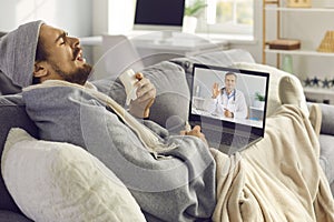 Sick man coughing and sneezing while having online medical consultation with eHealth doctor