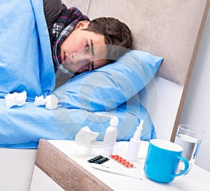 Sick man with flu lying in the bed