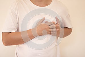 Sick man having painful Chest having heart attack at home,Hands squeezing Chest.healthcare concept