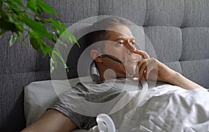 Sick man with inhalator mask photo