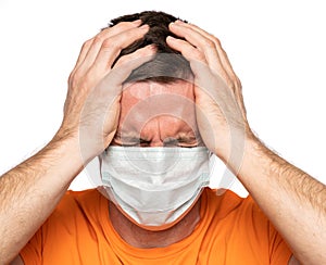 Sick man in mask. Man suffering from headach over white background photo